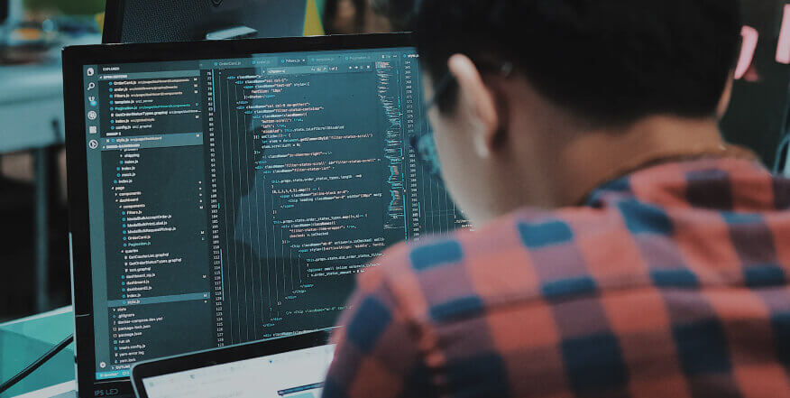 man working on a desktop